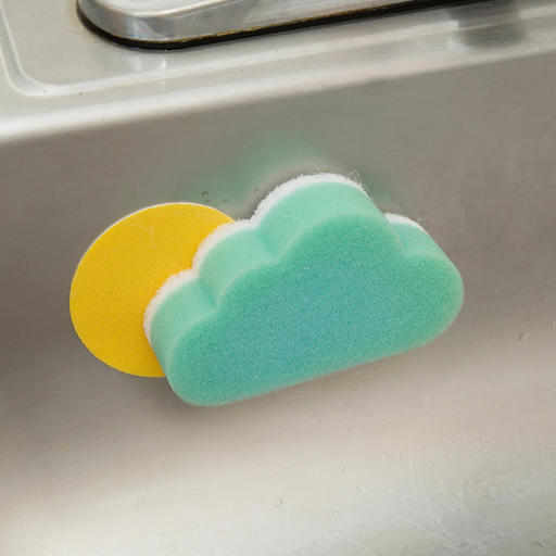 A blue sponge on a yellow holder, on a kitchen sink.