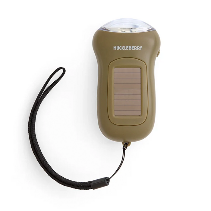 An olive green Huckleberry portable solar light with a black wrist strap, shown on a clean white background.