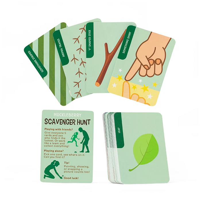 A set of illustrated cards for a scavenger hunt game, including a main 'Huckleberry Scavenger Hunt' card, a stack of cards, and several example cards fanned out behind it on a white background.
