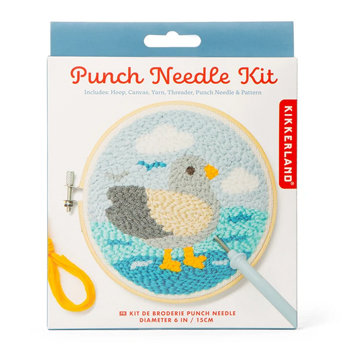 Kikkerland Punch Needle Kit in its retail packaging, featuring a completed duck embroidery design in a hoop, a light blue thimble, and a punch needle tool on a white background.