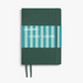 A Leuchtturm1917 notebook with a dark green textured cover, a blue and white striped paper band labeled 'COVERED IN SUNSHINE', and matching green ribbon bookmarks, shown on a light gray background.