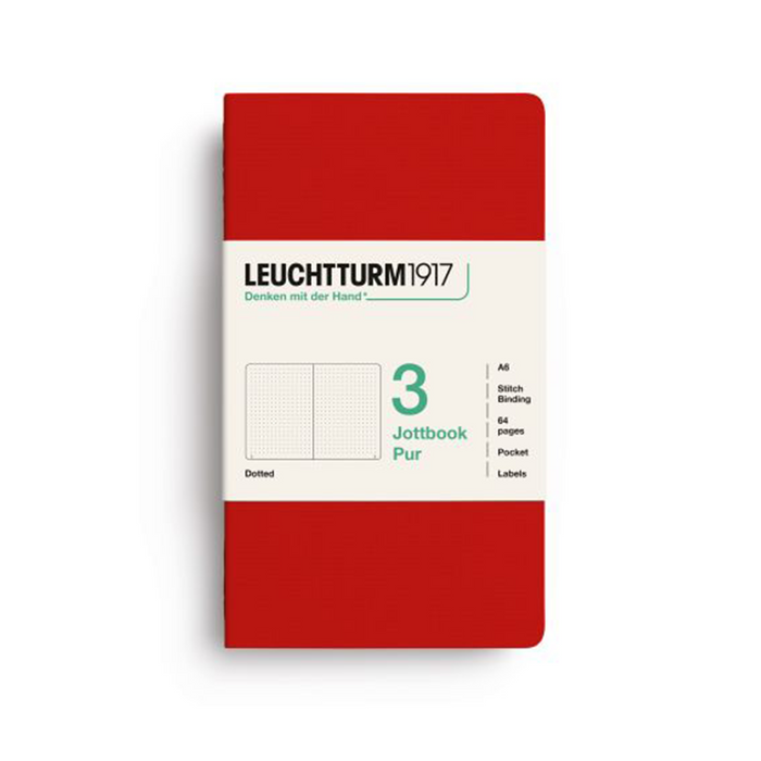 A Leuchtturm1917 notebook in a solid red cover with a white paper band around the middle, displayed on a clean white background.