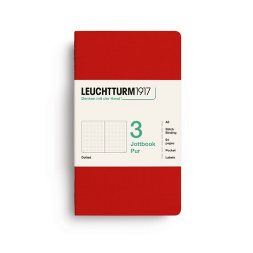 A Leuchtturm1917 notebook in a solid red cover with a white paper band around the middle, displayed on a clean white background.