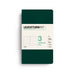 A Leuchtturm1917 notebook in dark green with a cream-colored paper label on the front, displayed on a clean white background.