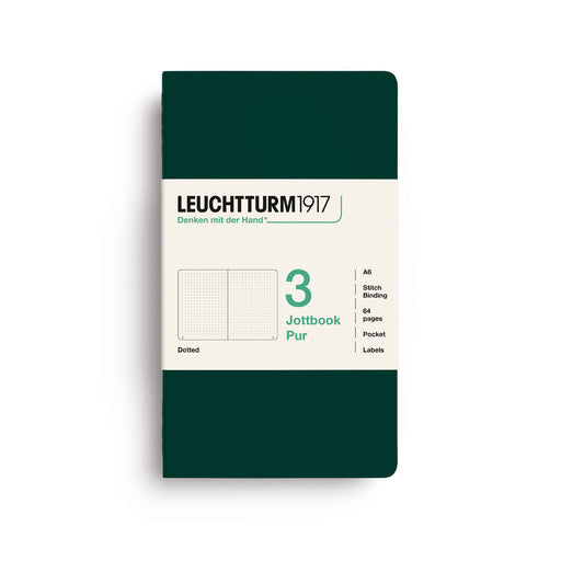 A Leuchtturm1917 notebook in dark green with a cream-colored paper label on the front, displayed on a clean white background.
