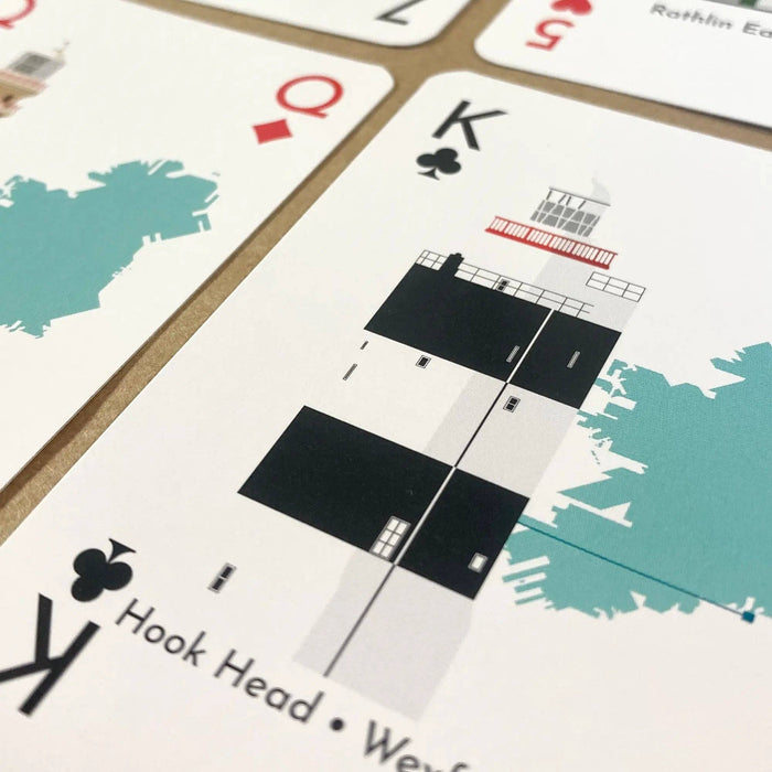 Close-up of playing cards with image of lighthouse.