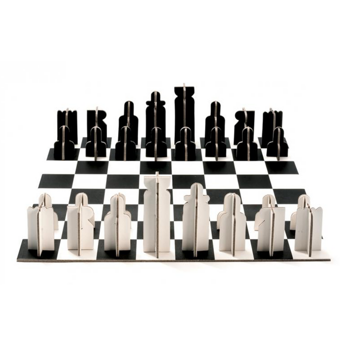 A black and white cardboard chess set with board and pieces against a white background.
