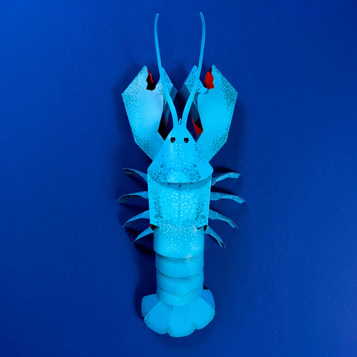 Blue lobster-shaped object on a blue background