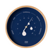 A round ocean clock with a light wood frame and a deep navy blue dial. The dial features white text and markings for temperature zones (Temperate, Tropical, Monsoon, Desert, Arid) and water droplet indicators, with white hands and a central gold accent.