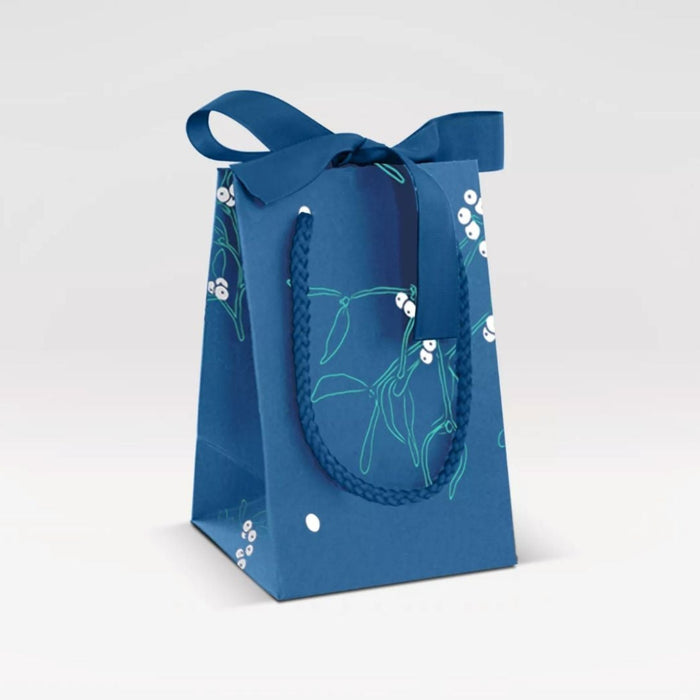 Blue gift bag with floral design on a white background