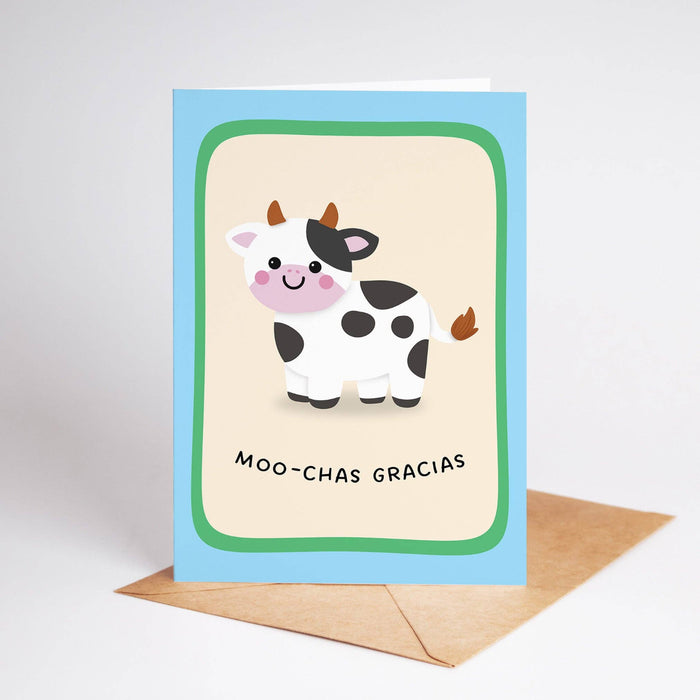 Greeting card with a cow illustration and 'Moo-chas Gracias' text on a beige background.