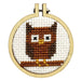 Cross-stitched owl design in a wooden hoop on a white background