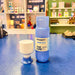 Blue Dopper water bottle and white cup on a blue surface with shelves in the background