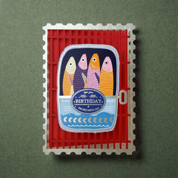 Decorative birthday card with colorful fish design on a red background