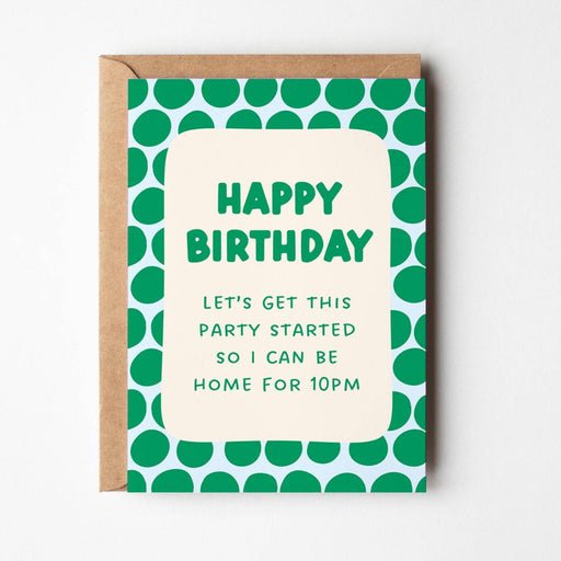 A birthday card with a kraft paper envelope, featuring a green and white polka dot border and a cream center panel that reads 'HAPPY BIRTHDAY LET'S GET THIS PARTY STARTED SO I CAN BE HOME FOR 10PM'.