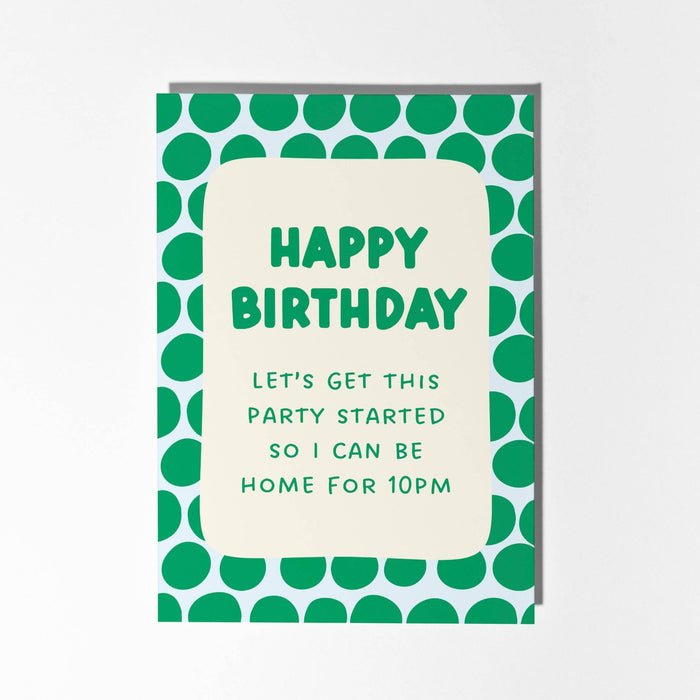A birthday card with a green and white polka dot border and a cream center panel that reads 'HAPPY BIRTHDAY' and 'LET'S GET THIS PARTY STARTED SO I CAN BE HOME FOR 10PM'.