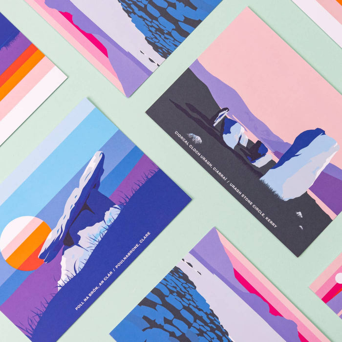 Colorful postcards with abstract designs and text on a checkered background