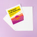 Greeting card with colorful sunset design and text on a purple background