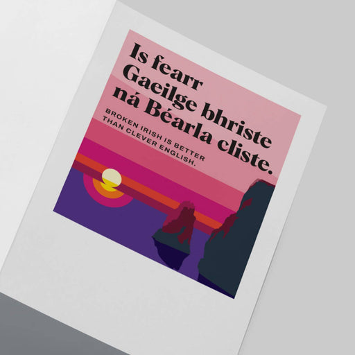 Card with text 'Is fearr Gaeilge bhriste na Báarlá cliste' and a stylized design on a light gray background