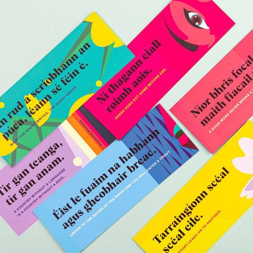 Colorful bookmarks with text and designs on a light gray background