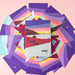 Colorful geometric patterned cards with 'muir' branding on a pink background