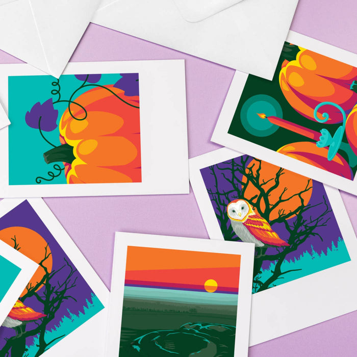 Colorful Halloween-themed greeting cards on a purple background