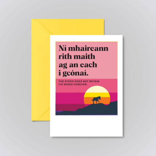 Greeting card with sunset design and text on a gray background