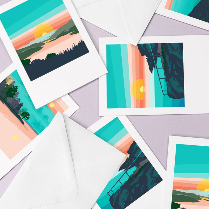 Colorful landscape illustrations on white cards with envelopes.