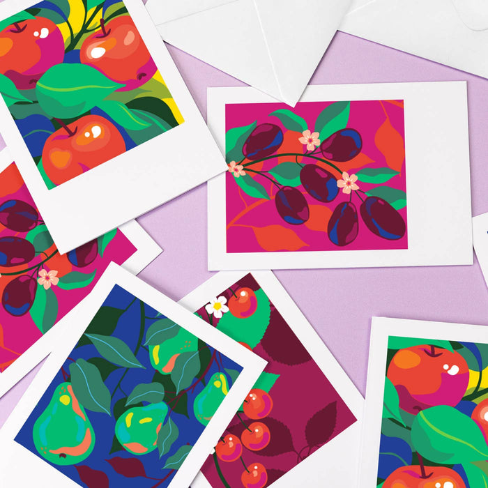 Colorful fruit illustrations on white cards with a purple background