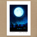 A square art print featuring a moonlit night scene with a large glowing full moon, stars, and dark stone monuments under a deep blue sky. The print has a wide white border and is photographed against a tan textured background.