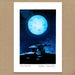 A square art print featuring a blue full moon over a stone dolmen at night, with a white border and the text 'POULNABRONE - Peter Donnelly' at the bottom, displayed against a brown textured background.
