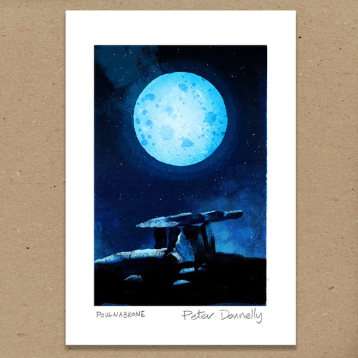 A square art print featuring a blue full moon over a stone dolmen at night, with a white border and the text 'POULNABRONE - Peter Donnelly' at the bottom, displayed against a brown textured background.