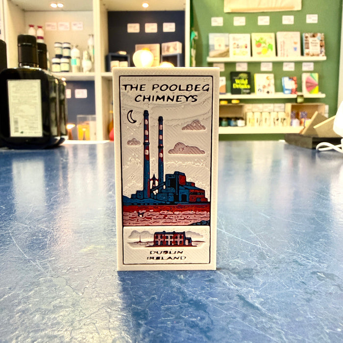 Bookmark with 'The Poolbeg Chimneys' design on a counter in a store.