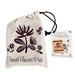 Travel flower press with floral design on a drawstring bag and product packaging.