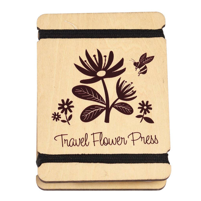 Travel flower press with floral design and 'Travel Flower Press' text on a white background