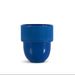 A blue cup with a ribbed upper band and a smooth dome-shaped base, centered on a plain white background.