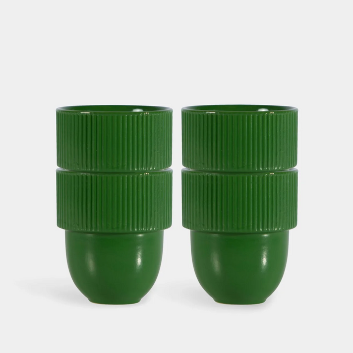 Two green ribbed plastic cups stacked vertically, shown side by side on a light gray background.