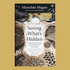 Book cover of 'Seeing What's Hidden' by Manchán Magan, featuring a black and beige Celtic-inspired design with a central white sunburst and gold-toned abstract foliage, shown against a solid mustard-yellow background.
