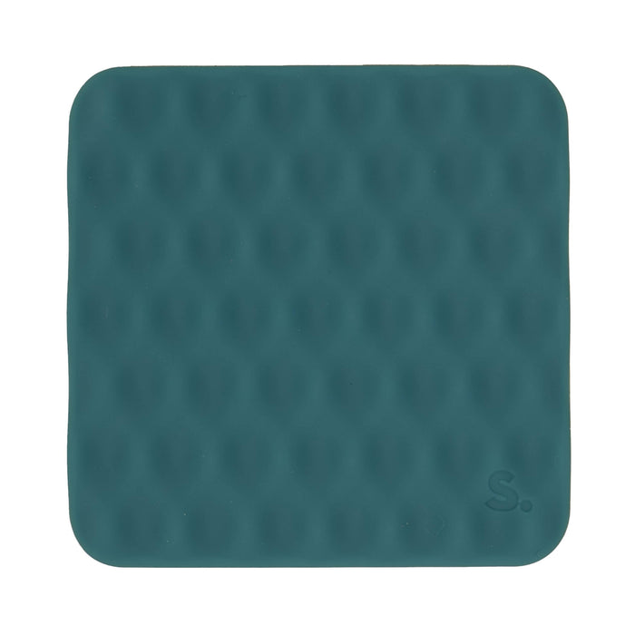 A square teal silicone mat with rounded corners, featuring a textured honeycomb pattern and a small embossed 'S.' logo in the bottom right corner, shown on a plain white background.