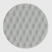 A round, light gray textured pad or disc with a subtle dimpled pattern and a small embossed 'S.' in the center, shown against a solid light gray background.