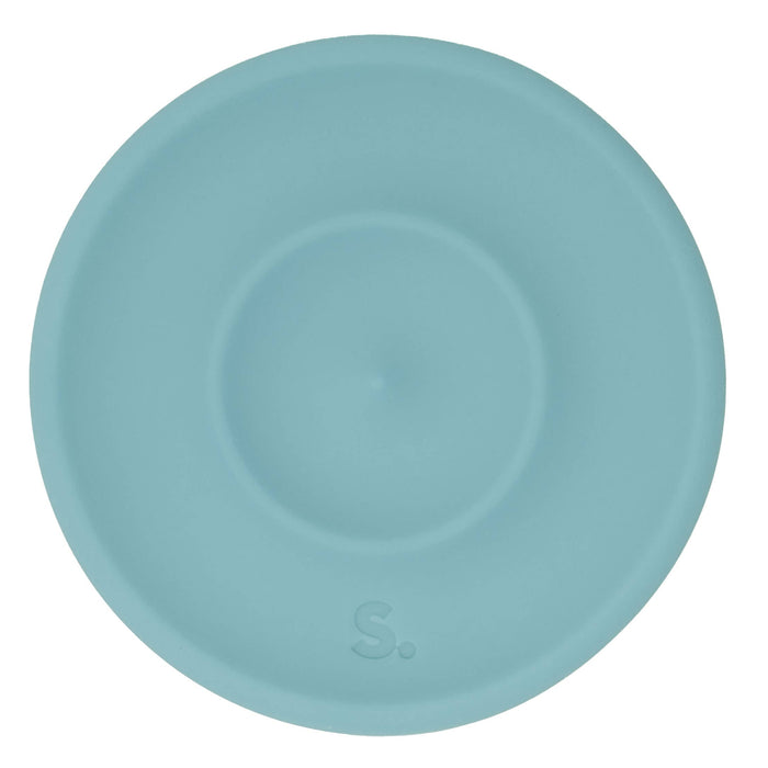 A light blue silicone lid with a circular design and a small embossed 'S.' logo near the bottom, shown on a solid white background.