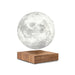 smart moon lamp hovering above wooden base in front of white background