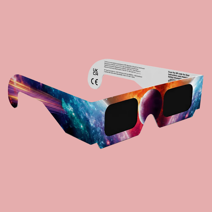 Galaxy-printed wraparound eclipse sunglasses with black lenses, shown on a solid pink background.