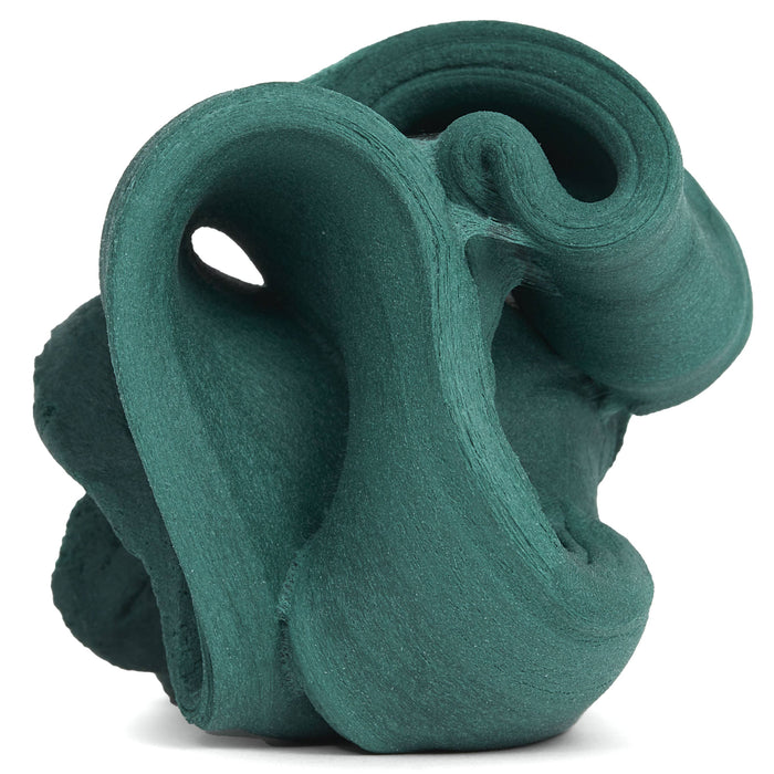 Teal ceramic sculpture on a white background