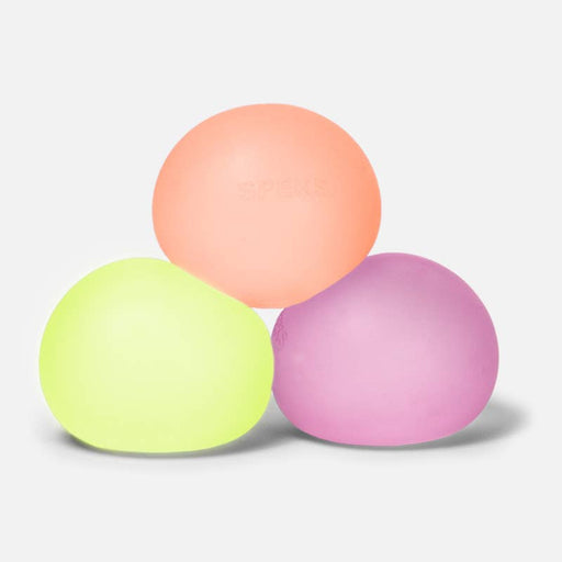 Three silicone lip balm cases in pastel peach, neon yellow-green, and pastel pink, arranged in a pyramid stack on a light gray background.