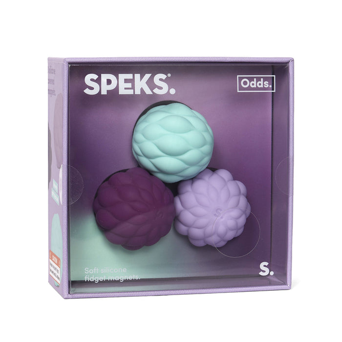 Speks product packaging with three textured balls on a purple background