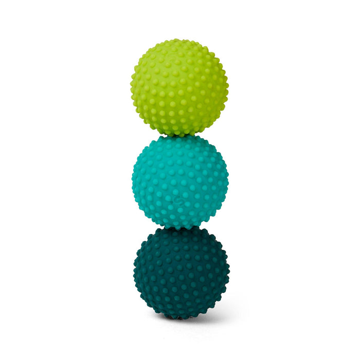Three textured balls stacked on a white background