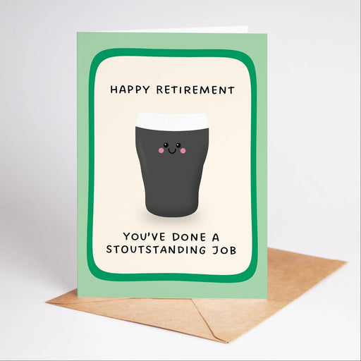 A square retirement greeting card with a light green border and a cartoon pint glass illustration, shown standing upright with a brown envelope on a light gray background. The card reads 'HAPPY RETIREMENT' and 'YOU'VE DONE A STOUTANDING JOB'.