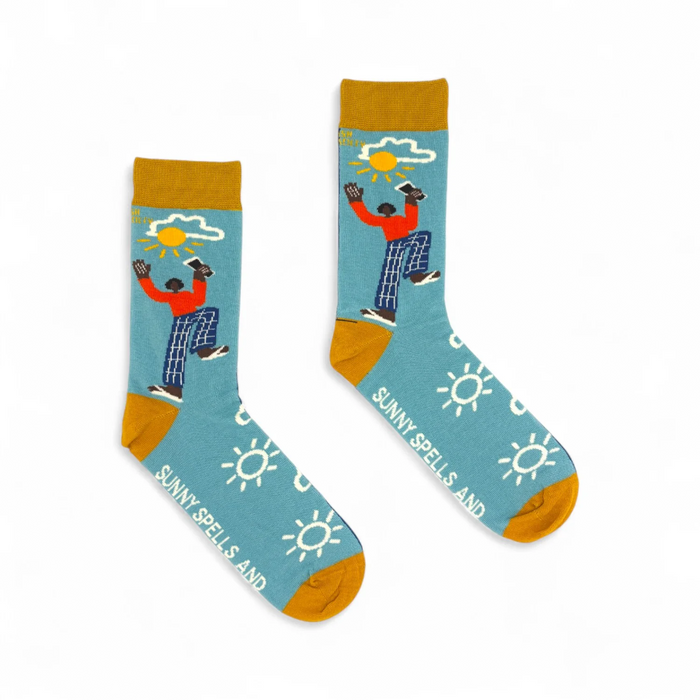 Colorful socks with a design of a person holding a sun, on a white background