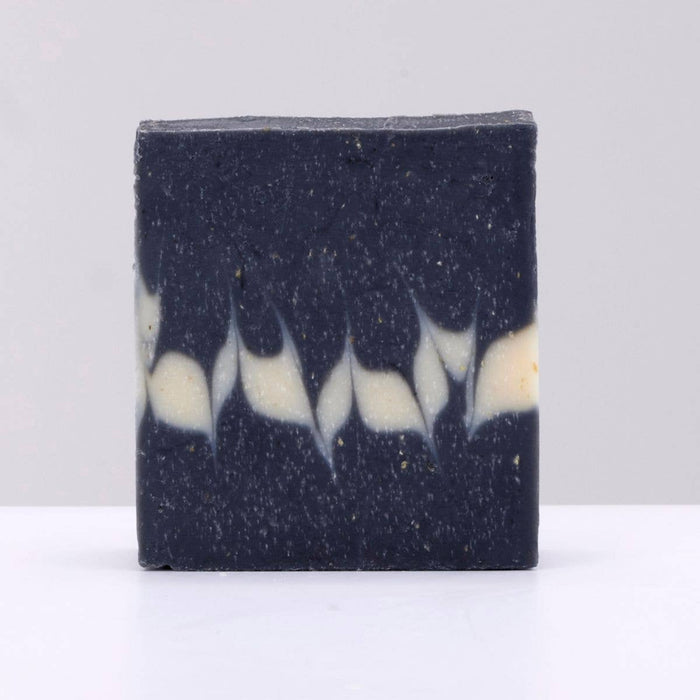 Bar of soap with black and white color pattern on a white background